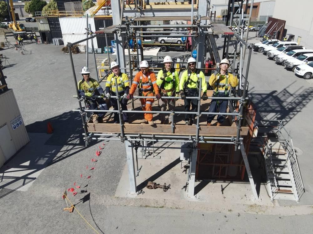 A scaffolding crew on a completed scaffold