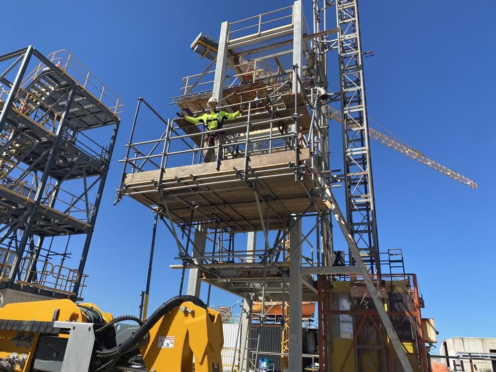 A scaffold tower being built on site